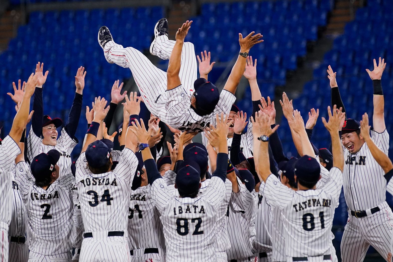 Japan's baseball team celebrates with manager Atsunori Inaba after <a href="index.php?page=&url=https%3A%2F%2Fwww.cnn.com%2Fworld%2Flive-news%2Ftokyo-2020-olympics-08-07-21-spt%2Fh_20d805ee1b60a343b67edab57c1bb89c" target="_blank">winning the gold-medal game</a> against the United States on August 7.