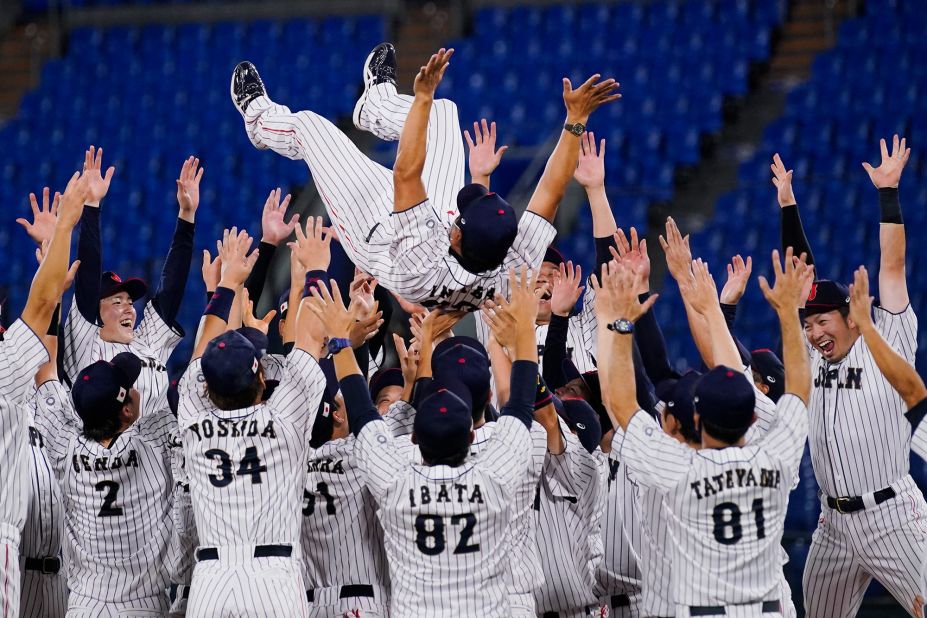 Japan's baseball team celebrates with manager Atsunori Inaba after <a href="https://www.cnn.com/world/live-news/tokyo-2020-olympics-08-07-21-spt/h_20d805ee1b60a343b67edab57c1bb89c" target="_blank">winning the gold-medal game</a> against the United States on August 7.