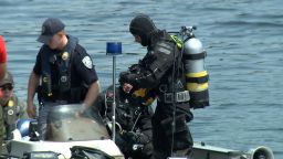 Search divers found a submerged car and human remains at the bottom of the Connecticut River.
