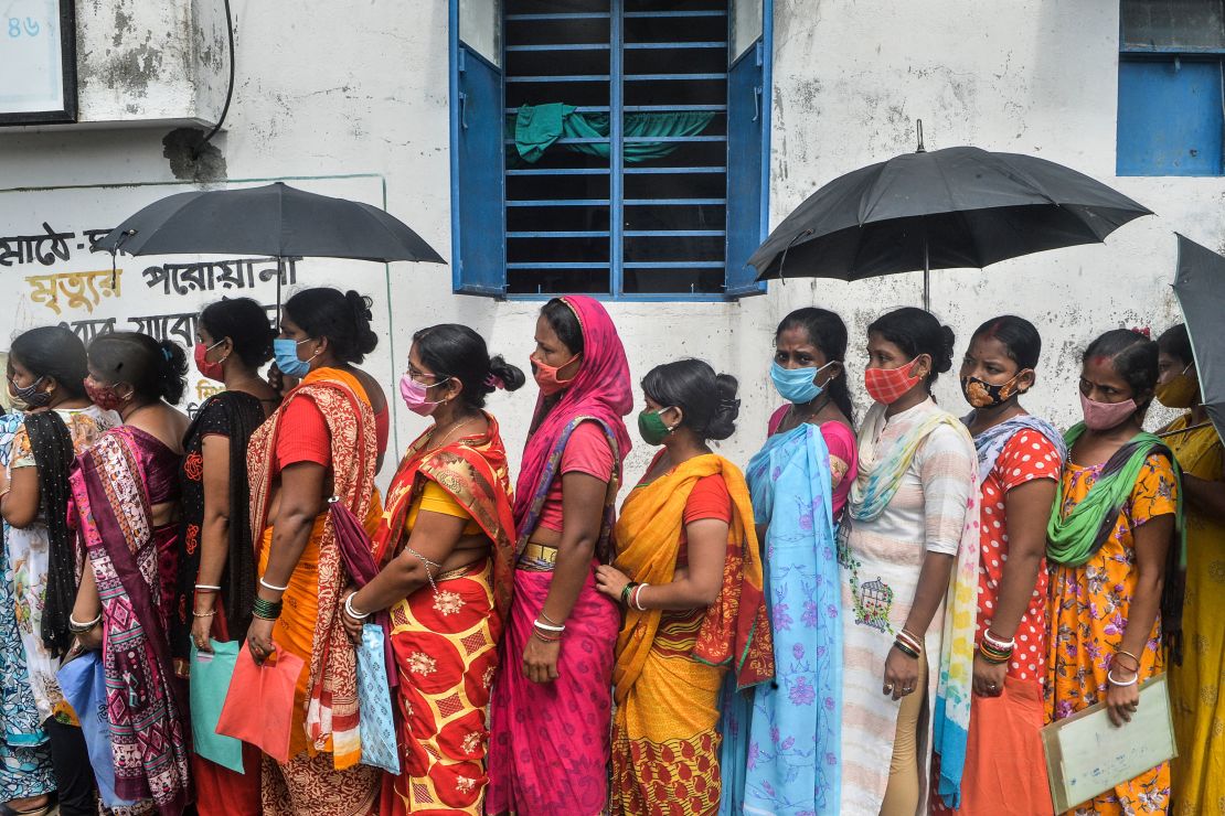 Women wait to receive the Covishield vaccine at a health center in Siliguri, West Bengal. India blocked vaccine exports in March to battle a devastating second wave of infections.