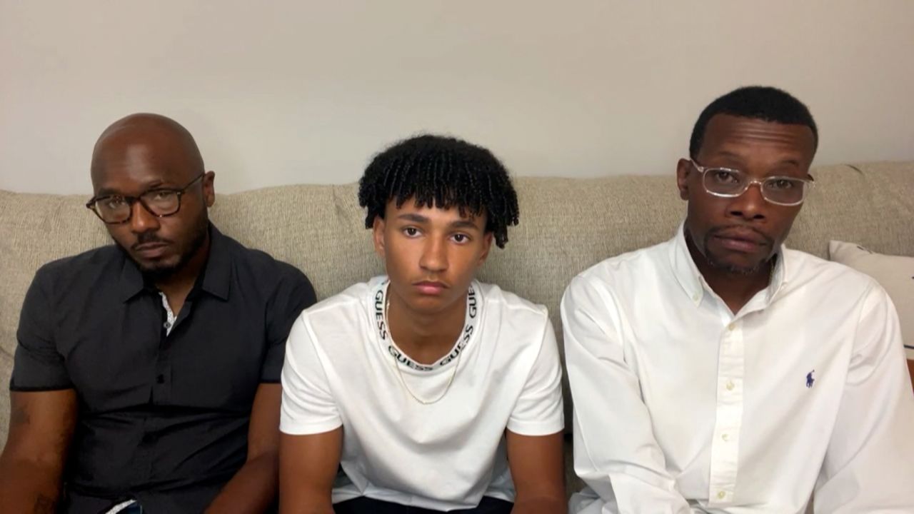 Roy Thorne, left, is seen with his 15-year-old son Samuel, middle, and realtor Eric Brown. All three were handcuffed by Wyoming, Michigan, police officers while touring a home.