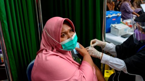 A woman receives a Sinovac vaccine in Banda Aceh, Indonesia. With less than 8% of its population fully vaccinated, Indonesia has overtaken India as Asia's new covid epicenter.