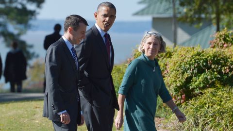 Then-President Barack Obama walks with senior White House adviser David Plouffe, left, and Dunn to debate preparation in 2012.