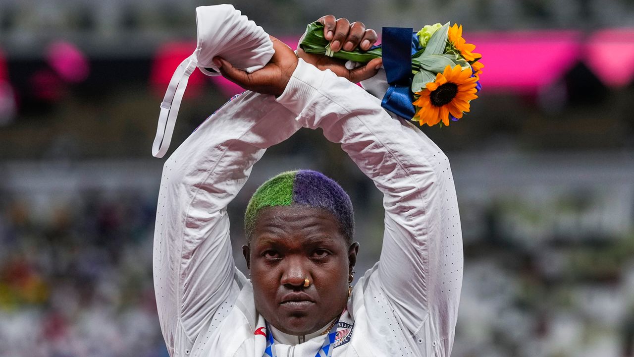 Raven Saunders performs her X protest on the podium in Tokyo.