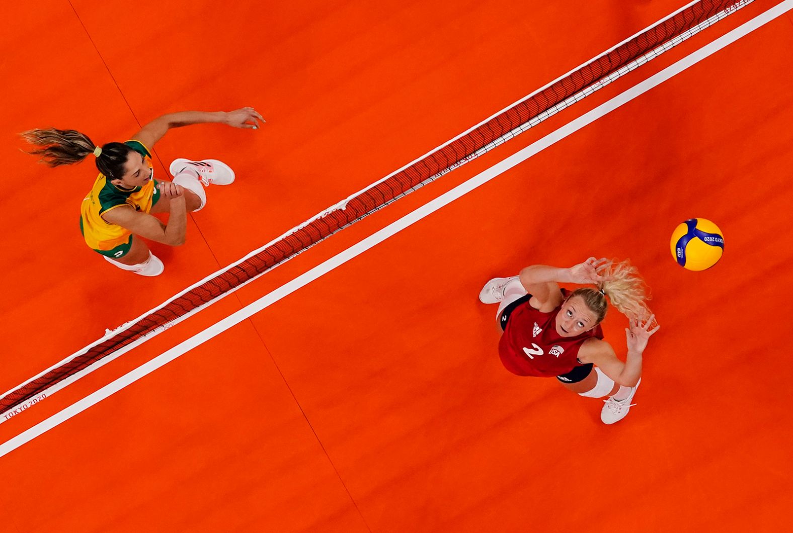 The United States' Jordyn Poulter, right, sets the ball during <a href="https://www.cnn.com/world/live-news/tokyo-2020-olympics-08-08-21-spt/h_1307b067886f6129d5a535fad820afdc" target="_blank">the gold-medal volleyball match</a> against Brazil on August 8. The Americans defeated Brazil 3-0. It is the United States' first-ever gold medal in women's volleyball.