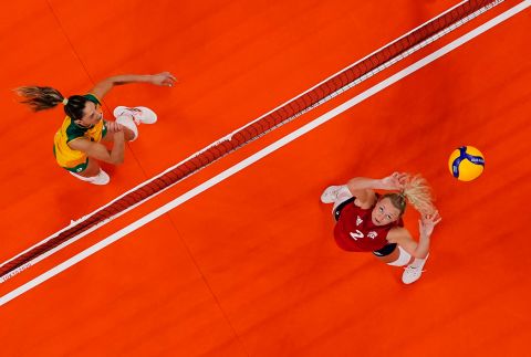 The United States' Jordyn Poulter, right, sets the ball during <a href="https://www.cnn.com/world/live-news/tokyo-2020-olympics-08-08-21-spt/h_1307b067886f6129d5a535fad820afdc" target="_blank">the gold-medal volleyball match</a> against Brazil on August 8. The Americans defeated Brazil 3-0. It is the United States' first-ever gold medal in women's volleyball.