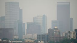 Smoke from western wildfires obscures the skyline of Denver on Saturday, Aug. 7, 2021. 