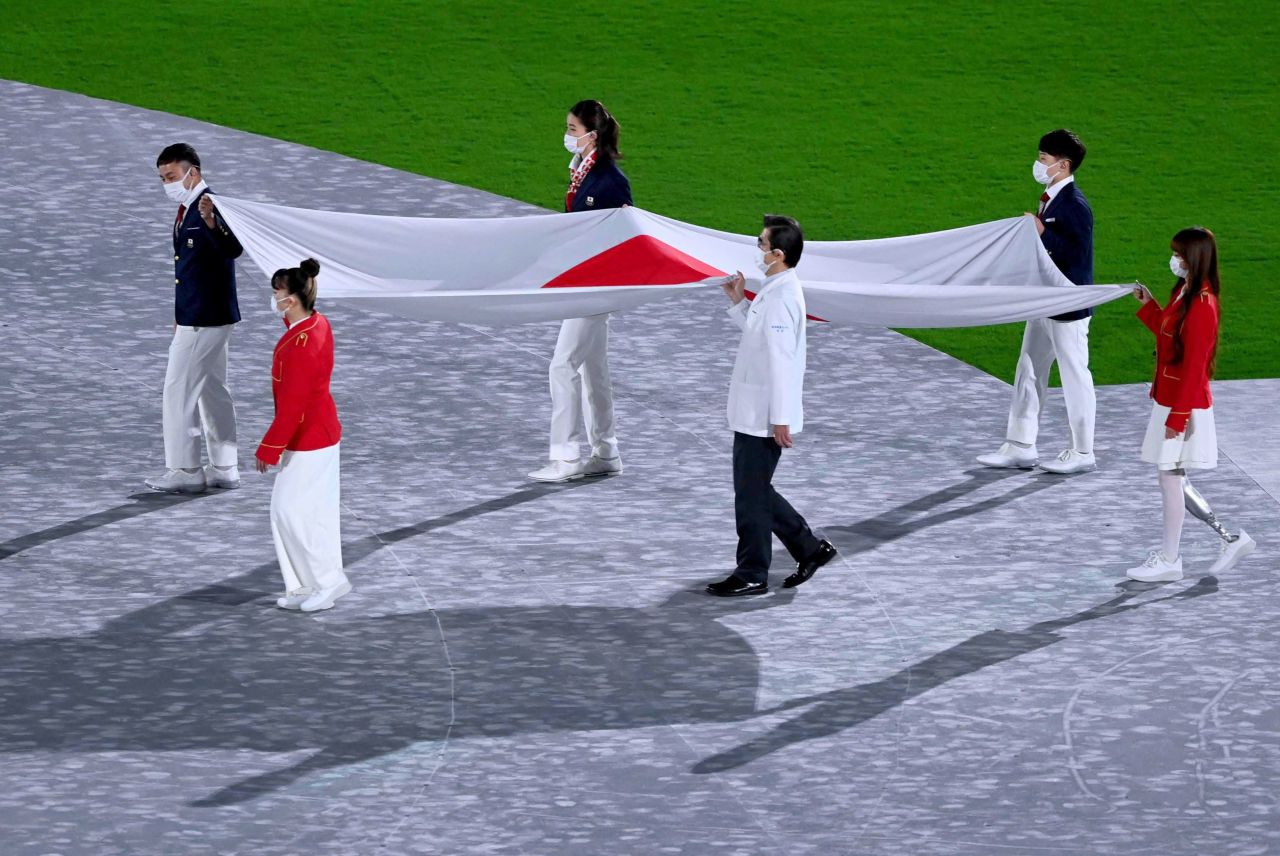 The Japanese flag is brought into the stadium at the start of the closing ceremony.
