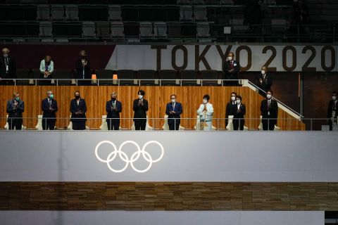 Dignitaries applaud at the beginning of the closing ceremony.