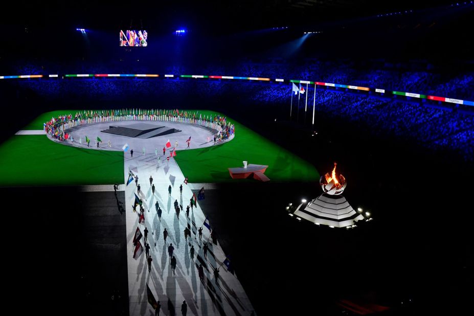 The flags of each participating nation are brought into the stadium for the closing ceremony.