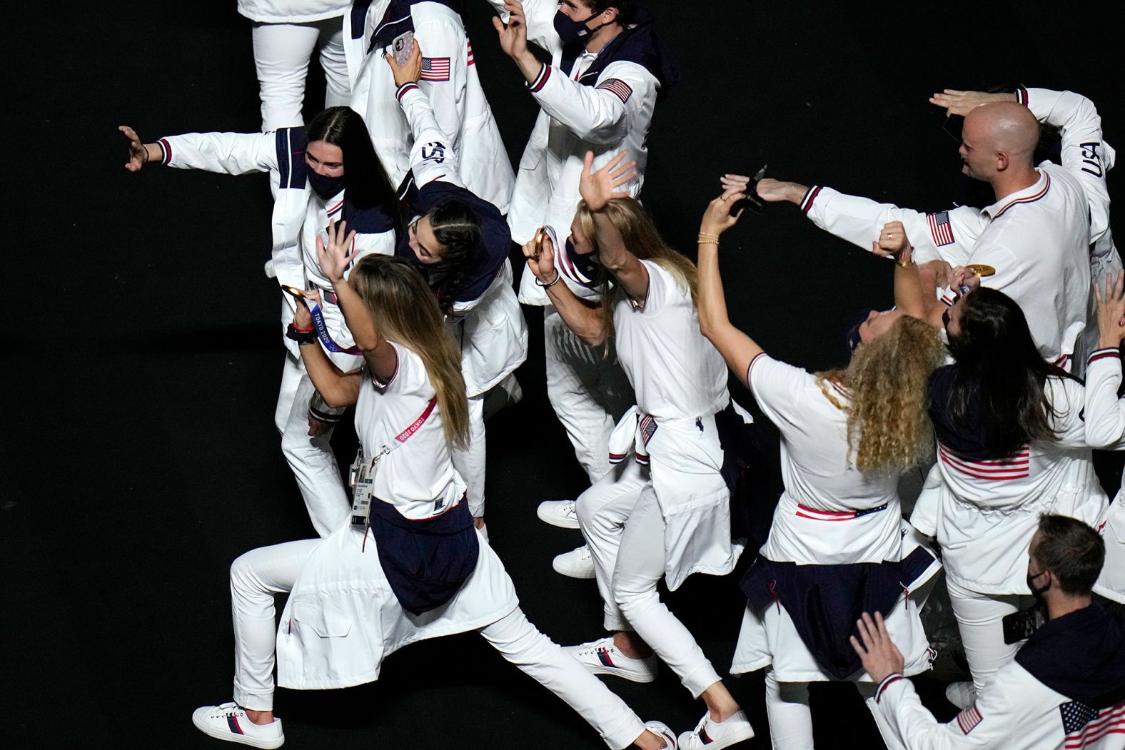 American athletes show their medals to a video camera at the closing ceremony. <a href="https://www.cnn.com/2021/08/08/sport/olympics-usa-most-medals/index.html" target="_blank">The United States finished on top of the medal table</a> for the third straight Summer Olympics, winning 39 gold medals and 113 medals in all. Second-place China finished with 38 golds and 88 medals in all. Host nation Japan had a third-best 27 golds and won a total of 58 medals.