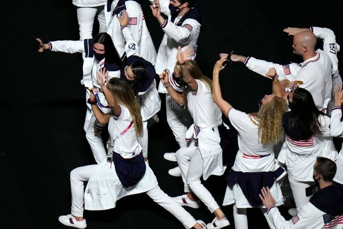 American athletes show their medals to a video camera at the closing ceremony. <a href="index.php?page=&url=https%3A%2F%2Fwww.cnn.com%2F2021%2F08%2F08%2Fsport%2Folympics-usa-most-medals%2Findex.html" target="_blank">The United States finished on top of the medal table</a> for the third straight Summer Olympics, winning 39 gold medals and 113 medals in all. Second-place China finished with 38 golds and 88 medals in all. Host nation Japan had a third-best 27 golds and won a total of 58 medals.