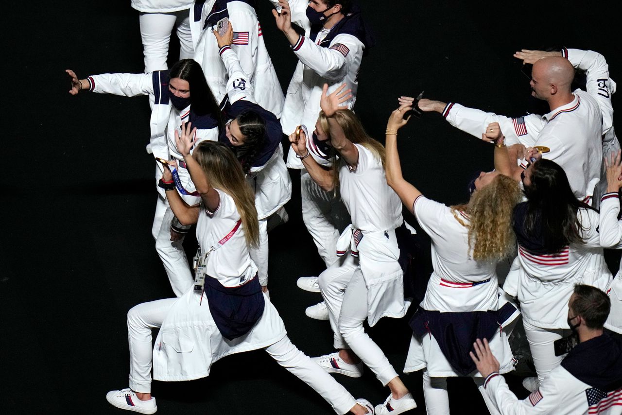 American athletes show their medals to a video camera at the closing ceremony. <a href="https://www.cnn.com/2021/08/08/sport/olympics-usa-most-medals/index.html" target="_blank">The United States finished on top of the medal table</a> for the third straight Summer Olympics, winning 39 gold medals and 113 medals in all. Second-place China finished with 38 golds and 88 medals in all. Host nation Japan had a third-best 27 golds and won a total of 58 medals.