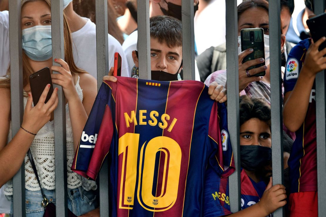 Fans gathered outside the Camp Nou stadium where Lionel Messi held his press conference in Barcelona.