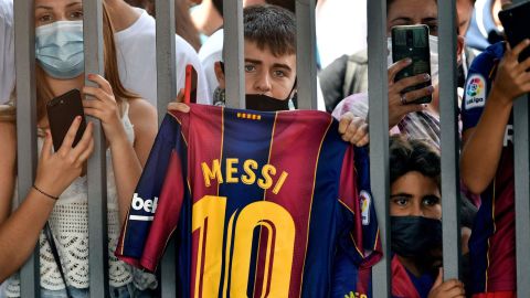Fans gathered outside the Camp Nou stadium where Lionel Messi held his press conference in Barcelona.