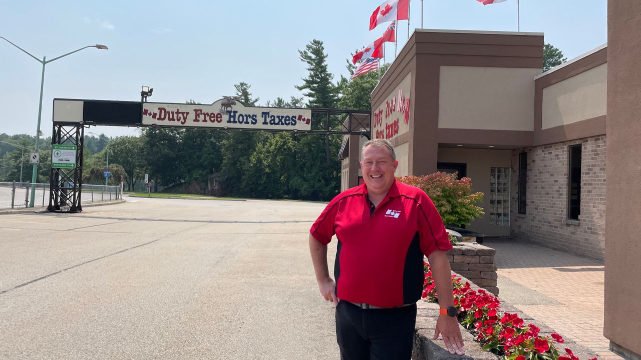 Jeff Butler stands outside his duty-free store just inside the Canadian border. He said he's not expecting a big influx of business at first.