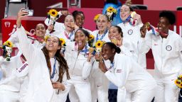 SAITAMA, JAPAN - AUGUST 8: Brittney Griner of USA takes a selfie with teammates during the medal ceremony of the Women's Basketball Gold Medal Final between United States and Japan on day sixteen of the Tokyo 2020 Olympic Games at Saitama Super Arena on August 8, 2021 in Saitama, Japan (Photo by Jean Catuffe/Getty Images)