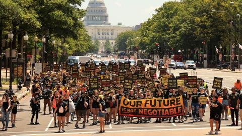 Hundreds of young activists march on Pennsylvania Avenue to the White House in June to demand that President Joe Biden take bold action on climate change.