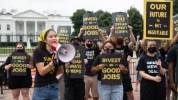Protesters with the Sunrise Movement protest in front of the White House against what they say is slow action on infrastructure legislation, job creation and addressing climate change, as well as against attempts to work with Senate Republicans in Washington, DC, June 4, 2021.