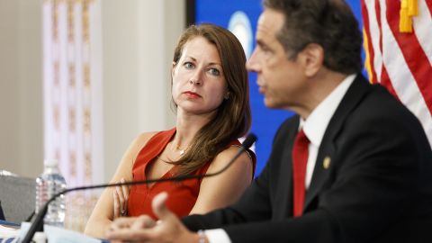 Melissa DeRosa, left, secretary to New York Gov. Andrew Cuomo, listens as Cuomo speaks during his daily briefing in a conference room at the New York Stock Exchange on May 26, 2020.