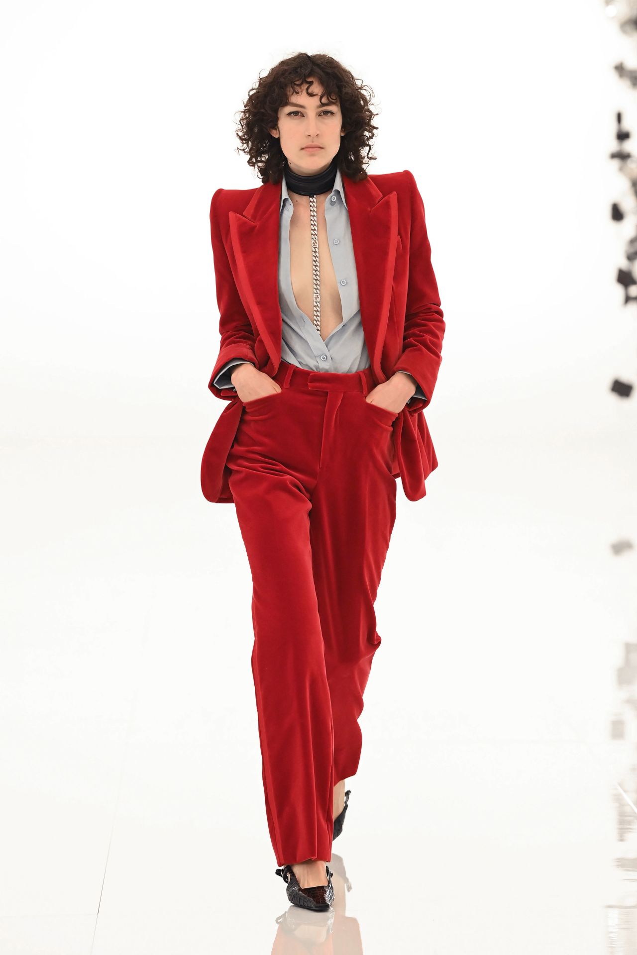 A model wears a revised version of Gwyneth Paltrow's red velvet suit  at the 2021 Gucci 'Aria' show. 