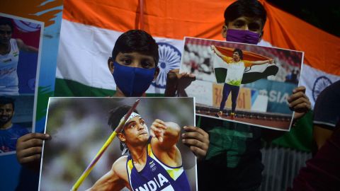 Supporters of India's athlete Neeraj Chopra celebrate after he won the gold medal in the men's javelin throw during the Tokyo 2020 Olympic Games.