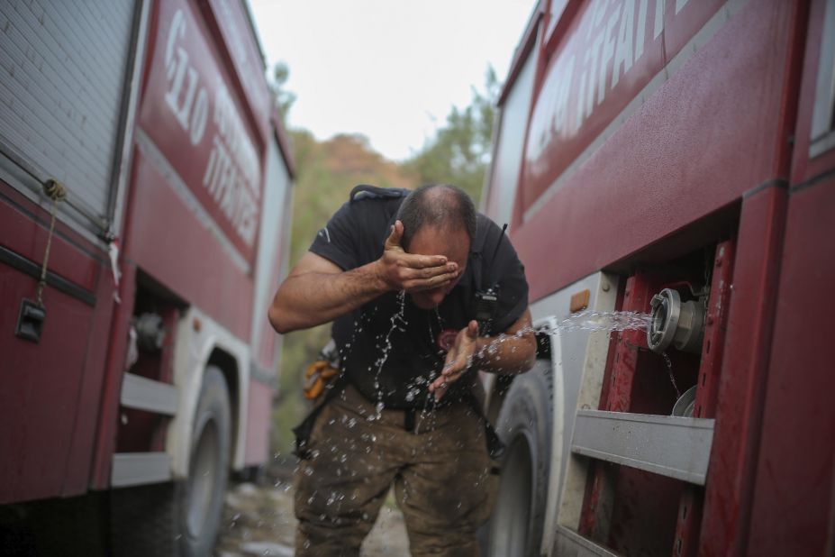 A firefighter washes his face in the Milas area of Mugla, Turkey, on August 7.