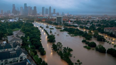 Downtown Houston is seen behind the flooded Buffalo Bayou a few days after Hurricane Harvey came ashore in August 2017. The Category 4 storm caused historic flooding. It set a record for the most rainfall from a tropical cyclone in the continental United States, with 51 inches of rain recorded in areas of Texas. An estimated 27 trillion gallons of water fell over Texas and Louisiana during a six-day period.