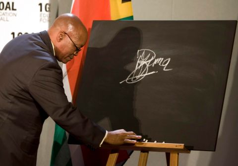 Zuma signs a blackboard in October 2009, pledging South Africa's support for a global campaign to ensure education for all the world's children.