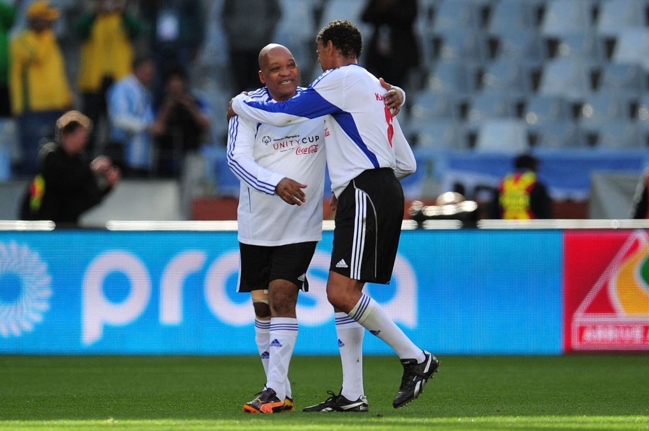 Zuma, left, and Sky Sports commentator Chris Kamara play a charity soccer match in Cape Town, South Africa, in July 2010.