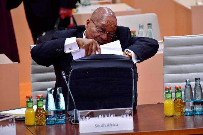 Zuma talks on his cell phone during a G20 session in Hamburg, Germany, in July 2017. A month later, <a href="index.php?page=&url=http%3A%2F%2Fwww.cnn.com%2F2017%2F08%2F08%2Fafrica%2Fzuma-south-africa-vote%2Findex.html" target="_blank">he survived an ouster attempt</a> in his country's National Assembly. A motion of no-confidence was defeated by 198 votes to 177.