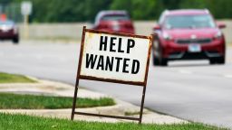 A help wanted sign is displayed at a gas station in Mount Prospect, Ill., Tuesday, July 27, 2021. 