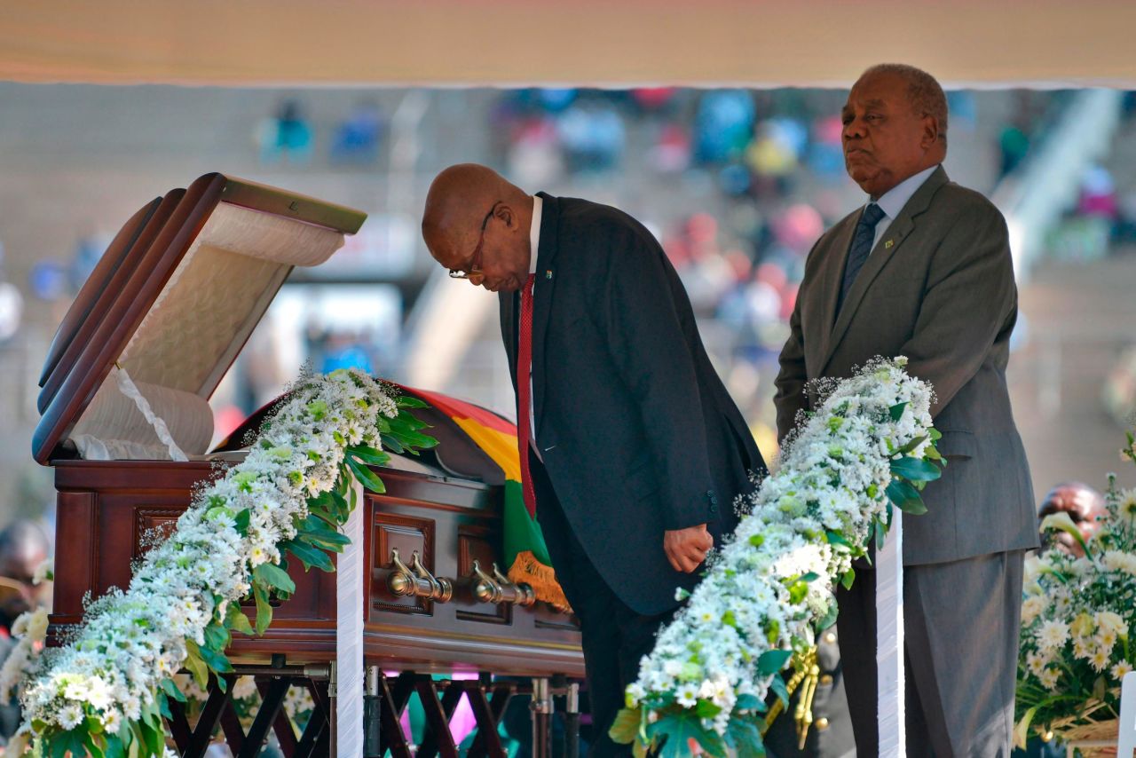 Zuma bows toward the casket of the late Zimbabwean President Robert Mugabe during a farewell ceremony in Harare, Zimbabwe, in September 2019.