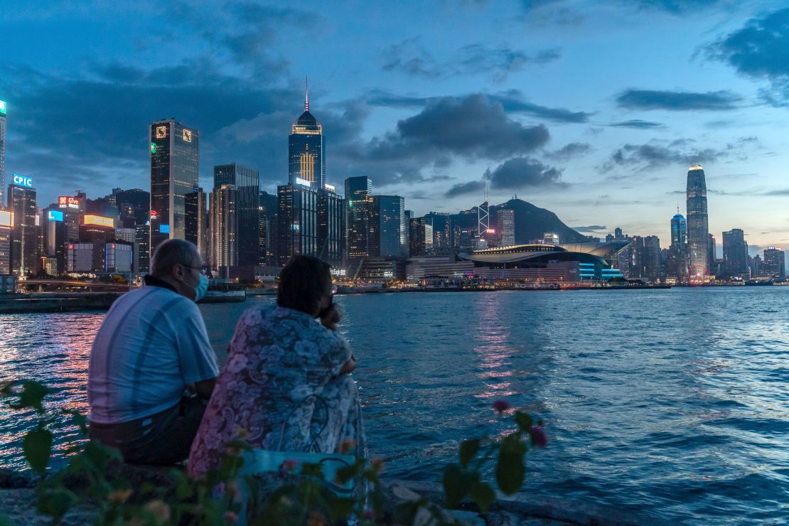 A couple takes in the Hong Kong sunset on July 30, 2020.   