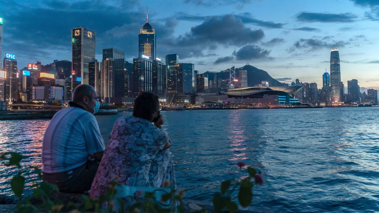 A couple takes in the Hong Kong sunset on July 30, 2020.   