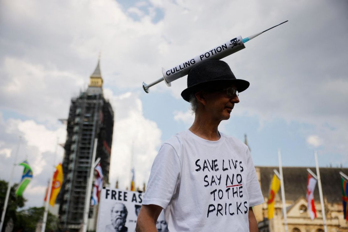 Anti-vaccination protesters against the coronavirus vaccine gather in Parliament Square outside the Houses of Parliament in central London on July 19, 2021