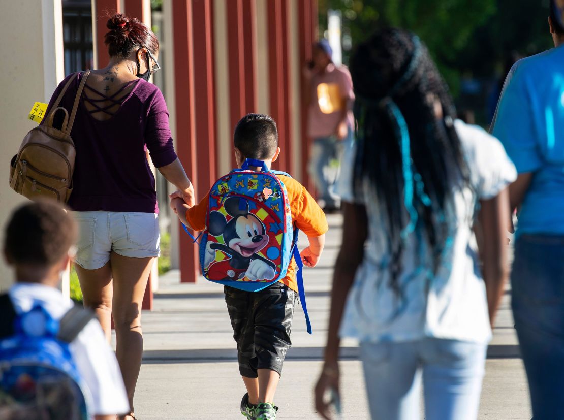 Parents of Tice Elementary School students drop their kids off for the first day of school in Fort Myers, Florida, on Tuesday, August 10.