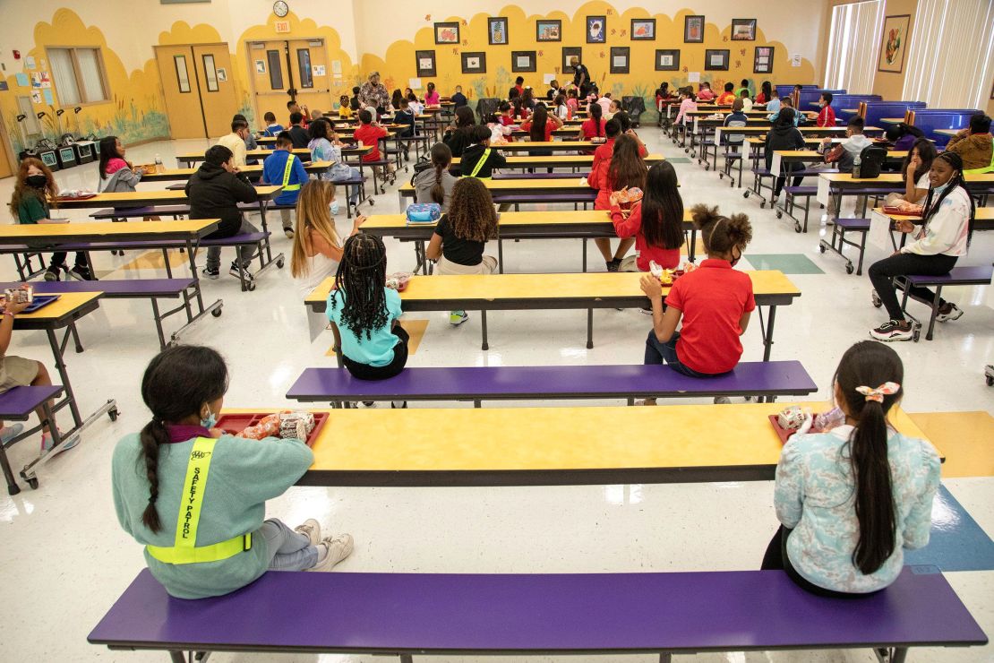 Students eat their lunch socially distanced at Belvedere Elementary School in West Palm Beach, Florida, on August 10, 2021.