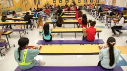 Students eat their lunch socially distanced at Belvedere Elementary School in West Palm Beach, Florida, Tuesday, Aug. 10, 2021, the first day of the school year.