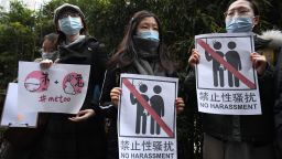 Supporters of Zhou Xiaoxuan, a feminist figure who rose to prominence during Chinas #MeToo movement two years ago, display posters outside the Haidian District Peoples Court in Beijing on December 2, 2020, in a sexual harassment case against one of China's best-known television hosts. 