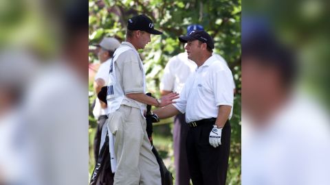 Ian Woosnam (right) stands with his caddie Miles Byrne as he explains his error during the final round of the 2001 Open Championship at Royal Lytham and St Annes.