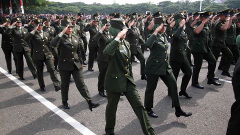 Female Indonesian soldiers march during the celebration of the 70th anniversary of Indonesian military on October 05, 2015 in Banda Aceh, Indonesia. 
