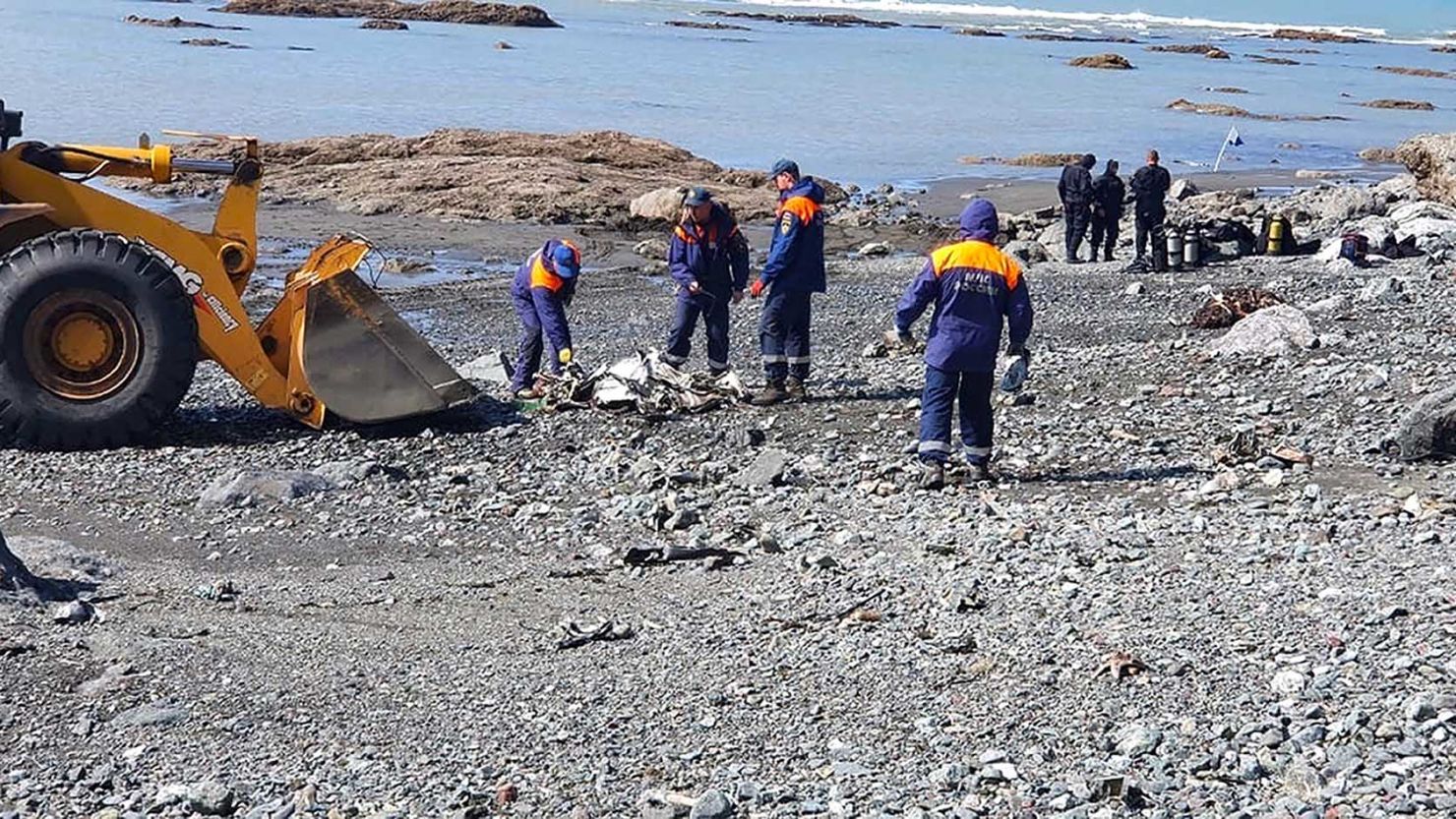 Emergency personnel work near the site where a helicopter carrying tourists crashed at Kurile Lake in the Kronotsky nature reserve on the Kamchatka Peninsula in Russia on Thursday.
