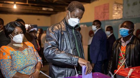 Zambia's incumbent president Edgar Lungu casts his vote at a polling station in Lusaka on August 12.