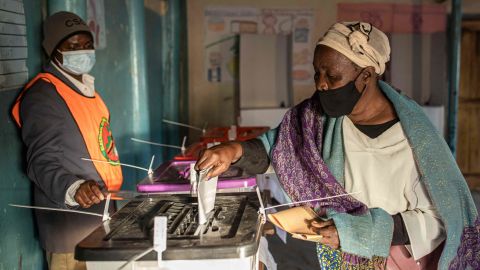 A woman casts her ballot in Lusaka after a tense campaign dominated by economic woes.