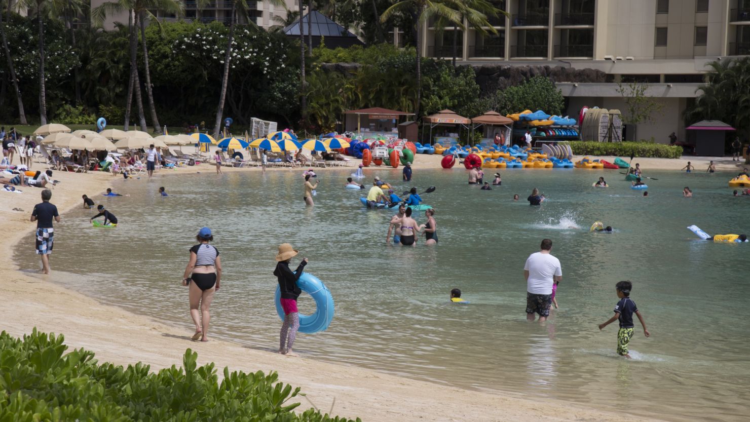 HONOLULU, HI - AUGUST 22:   With more than 270,000 visitors in Hawaii and the majority on Oahu, the tourists enjoy a gorgeous day at the beach unperturbed by Hurricane Lane's expected landfall in Waikiki in just two days as seen from the Hilton Hawaiian Village Resort's Lagoon & Beach on Wednesday, August 22, 2018 in Honolulu, Hawaii. Hurricane Lane is a high-end Category 4 hurricane and remains a threat to the entire island chain. (Photo by Kat Wade/Getty Images)