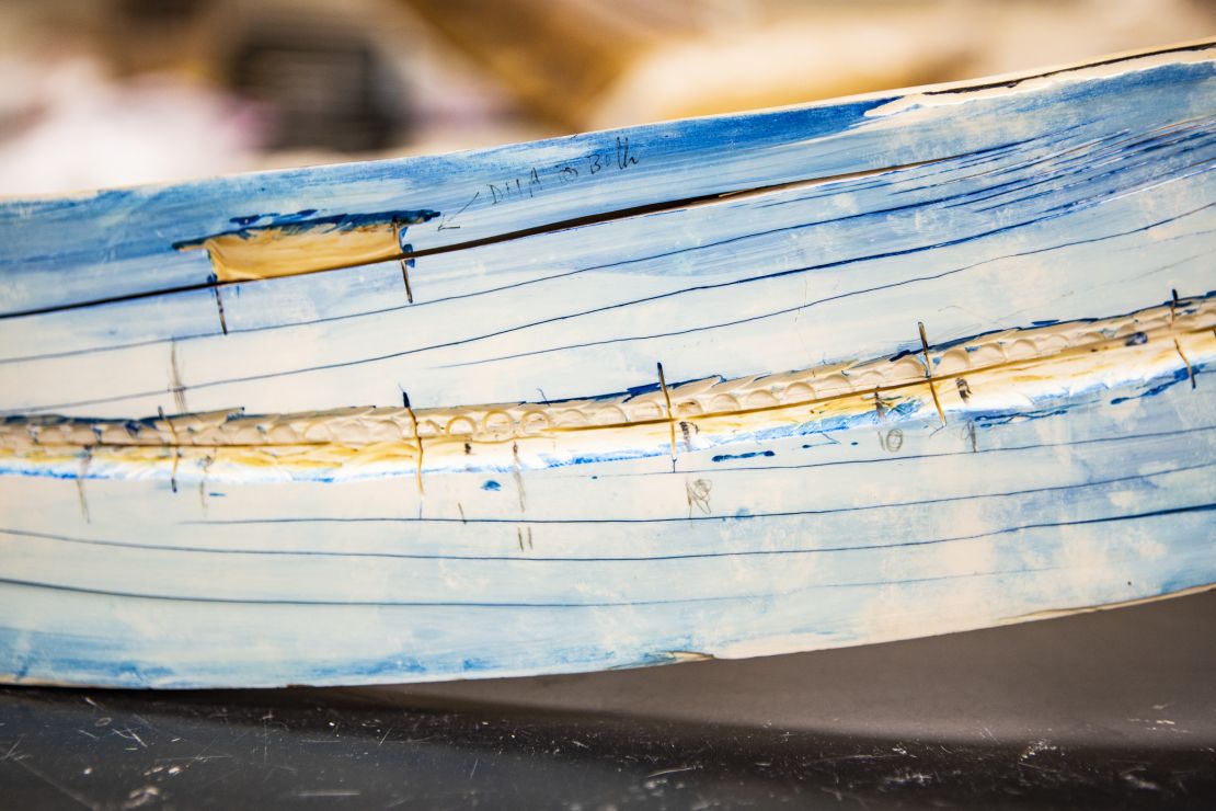 A close-up view shows the split mammoth tusk at the Alaska Stable Isotope Facility. Blue stain is used to reveal growth lines. Samples were taken along the tusk using lasers and other techniques, allowing isotope analysis that provided a record of the mammoth's life.