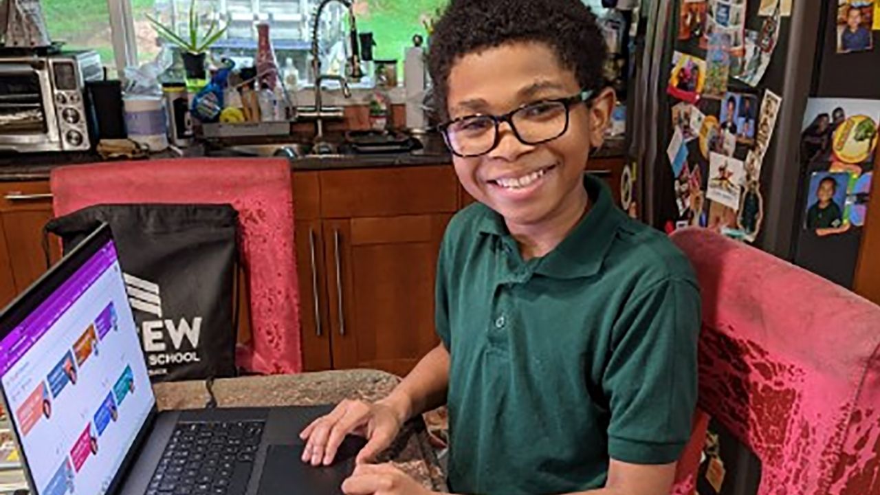 Shun Jester, 10, is comfortable on computers and likes virtual learning.