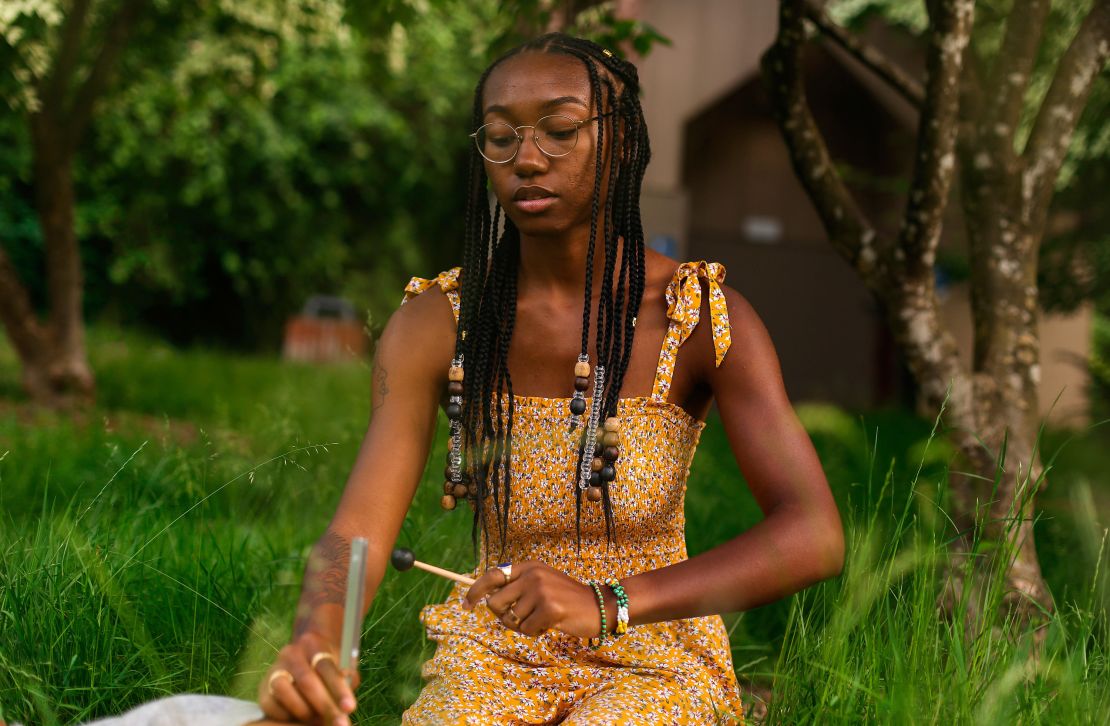 Kemi Mani, a spiritual adviser, uses a tuning fork during her practice. 
