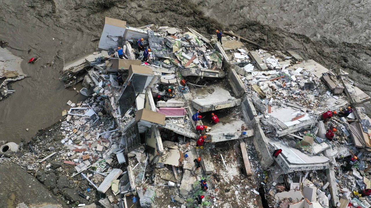A drone photo shows rescue operations at a collapsed building after floods in Bozkurt district in Kastamonu, Turkey on Thursday. 